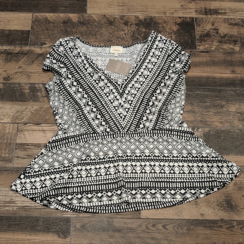 Anthropologie peplum top by Deletta